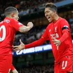 Liverpool's Roberto Firmino and Philippe Coutinho celebrate after Manchester City's Eliaquim Mangala scored an own during the Barclays Premier League match at the Etihad Stadium, Manchester. PRESS ASSOCIATION Photo. Picture date: Saturday November 21, 2015. See PA story SOCCER Man City. Photo credit should read: Richard Sellers/PA Wire. RESTRICTIONS: EDITORIAL USE ONLY No use with unauthorised audio, video, data, fixture lists, club/league logos or "live" services. Online in-match use limited to 75 images, no video emulation. No use in betting, games or single club/league/player publications.