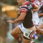 SYDNEY, AUSTRALIA - JULY 20: James Tedesco of the Roosters is tackled during the round 18 NRL match between the Sydney Roosters and the Newcastle Knights at Sydney Cricket Ground on July 20, 2019 in Sydney, Australia. (Photo by Jason McCawley/Getty Images)