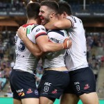 SYDNEY, AUSTRALIA - MARCH 29: James Tedesco of the Roosters celebrates scoring a try with team mates during the round three NRL match between the Parramatta Eels and the Sydney Roosters at ANZ Stadium on March 29, 2019 in Sydney, Australia. (Photo by Mark Metcalfe/Getty Images)